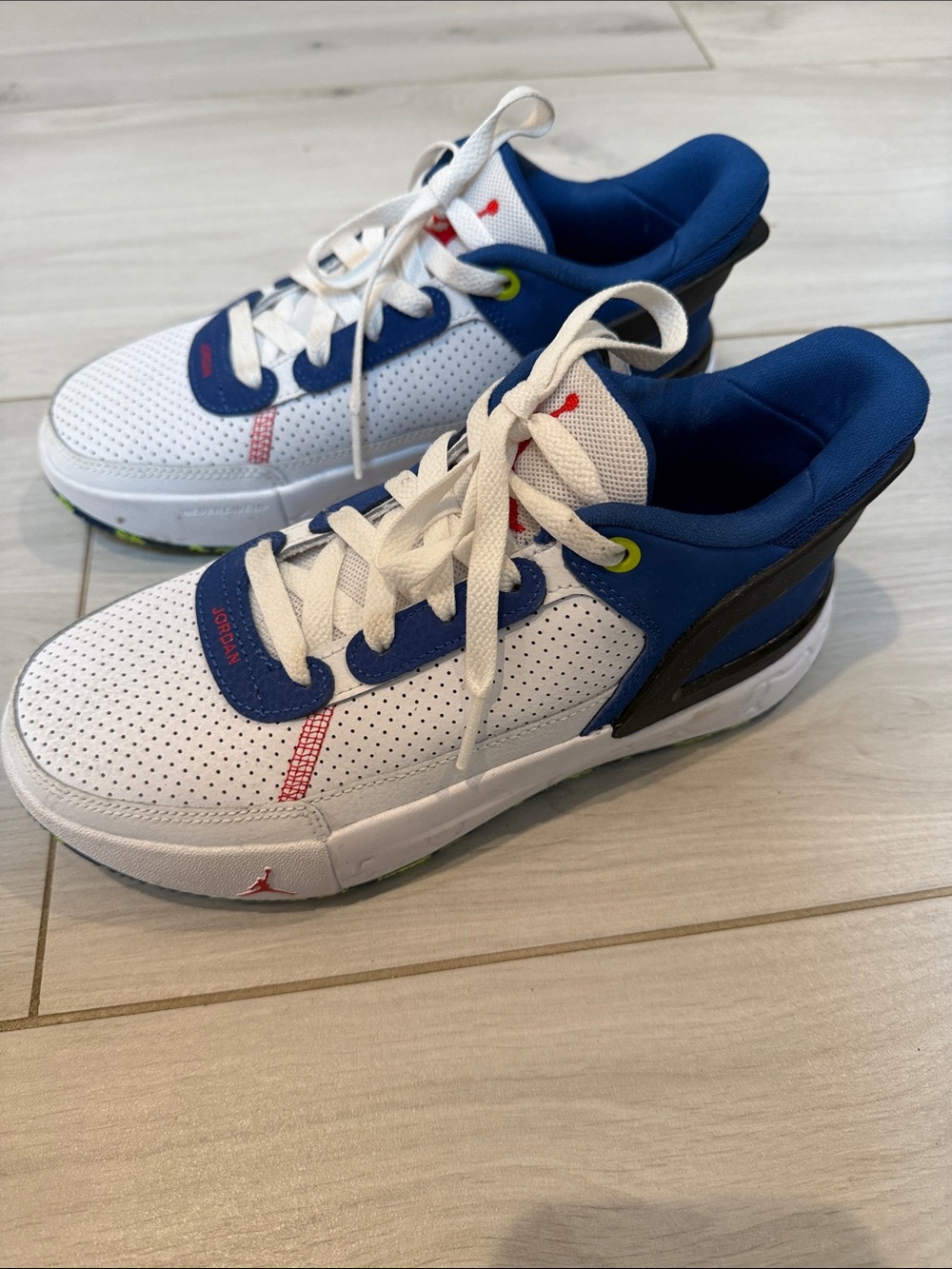 Jordan Kids White and Blue Low-Top Sneakers with Red Accents, size 4. Like new